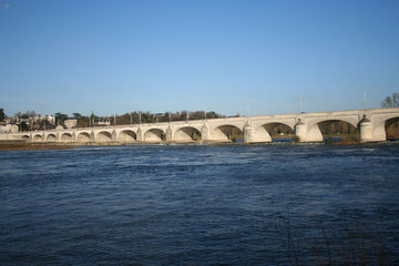 Fototapeta na wymiar stone bridge across river loire