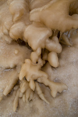 frozen water on a dark brown background.