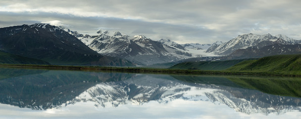panoramic landscape reflected in lake