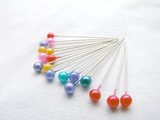 teamwork concept with tailor needles