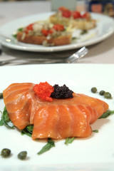 smoked salmon slices with red and black caviar