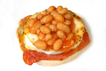 baked beans on an egg and bacon muffin