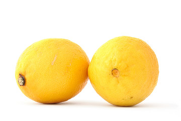 two fresh lemons on white