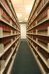 Zelfklevend Fotobehang teruglopende planken met wetboeken © Spiroview Inc.