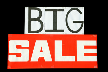 big sale sign in a shop window.