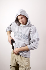 a young man holding a gun