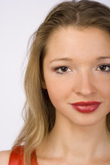 face of young woman in red