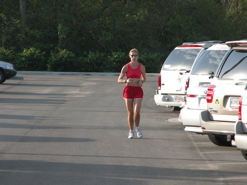 woman running in parking lot