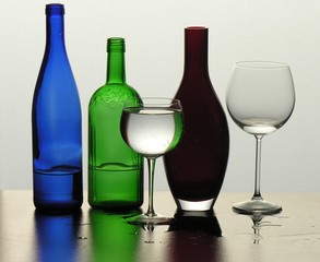 decorative bottles and two glasses