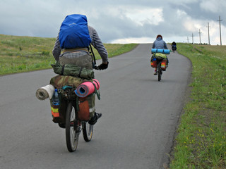 three cyclists go to road. - 2150151