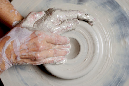 potter working clay