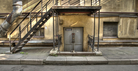 huge rusty building, small cute kitty.