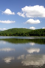 Fototapeta na wymiar reflection of clouds in mountain lake