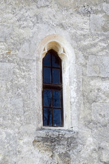 Fototapeta na wymiar window on stone wall