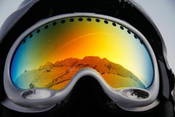 mountains reflected in glasses