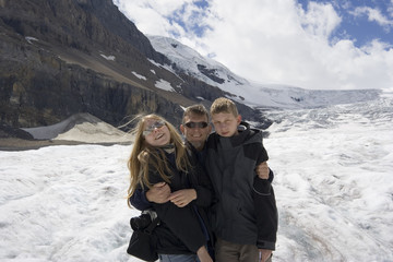 father and kids in the rockies