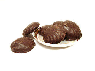 six chocolate brownies on a plate over white background