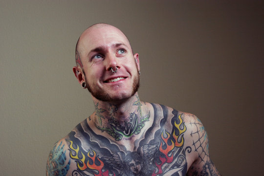 man with tattoo smiling