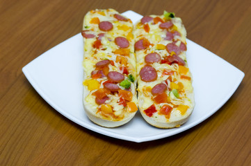 baguettes with pepperoni on the plate