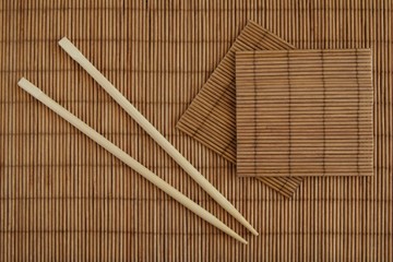 chopsticks and bamboo mat