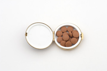 orange pills in a pillbox