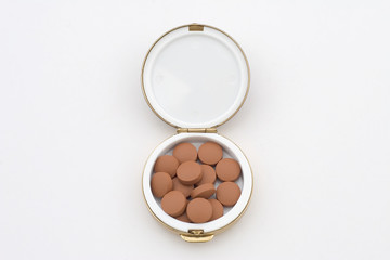 orange pills in a pillbox 2