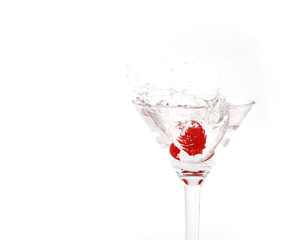 splashing cherry in martini glass