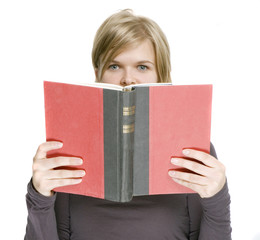 a girl is holding a book