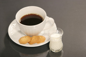 black coffee with milk on the side