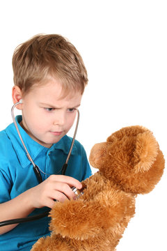 boy with stethoscope and toy