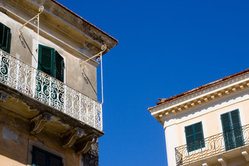 Fototapeta na wymiar old house with windows and balcony