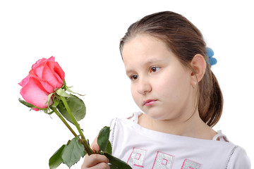 little girl holding flowers in her hand