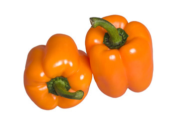 pair of fresh sweet bell orange peppers isolated on white backgr