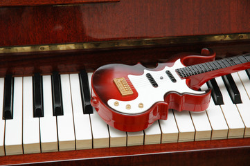 guitar on the piano keys