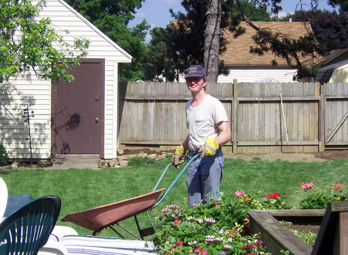 Man Pushing Wheelbarrow