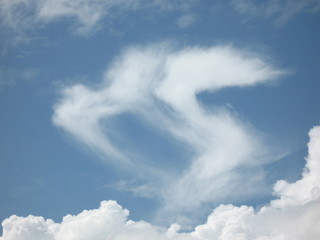 clouds of kissing couple