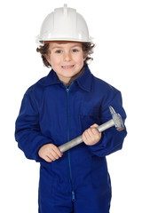 adorable boy dressed worker in a hammer and a helmet