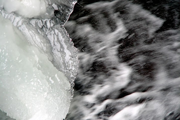 abstract snow and ice over flowing water