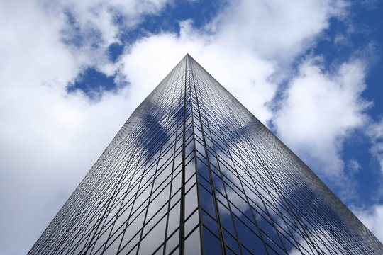 Corner Of Modern Building Against Blue Sky