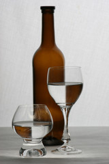 brown bottle and glasses