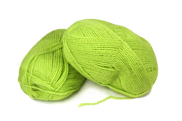 two skeins of green wool yarn.