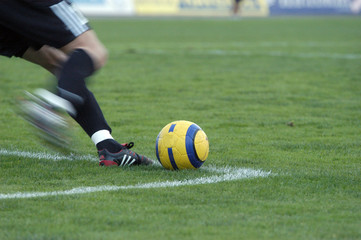 the football goalkeeper beats out a ball