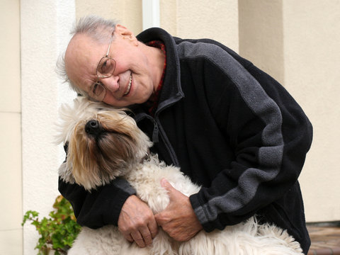 happy senior man and his dog