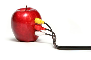 cables plugged into red apple