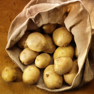 overflowing bag of potatos