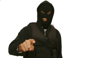 Portrait of man in mask standing against white background