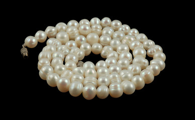 string of pearls isolated on black