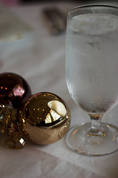 water glass with christmas ornaments