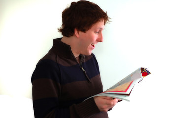 young man reading a magazine