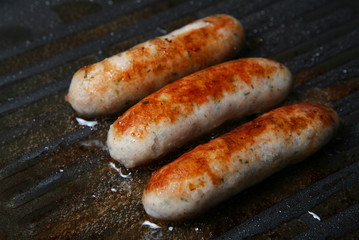 sausages frying
